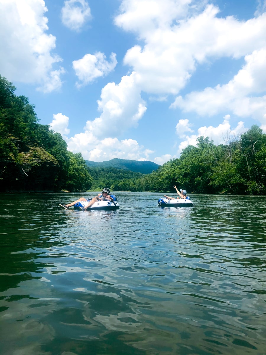 Sisters floating the Nolichucky River on tubes