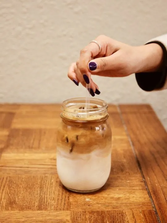 Woman stirring cold brew