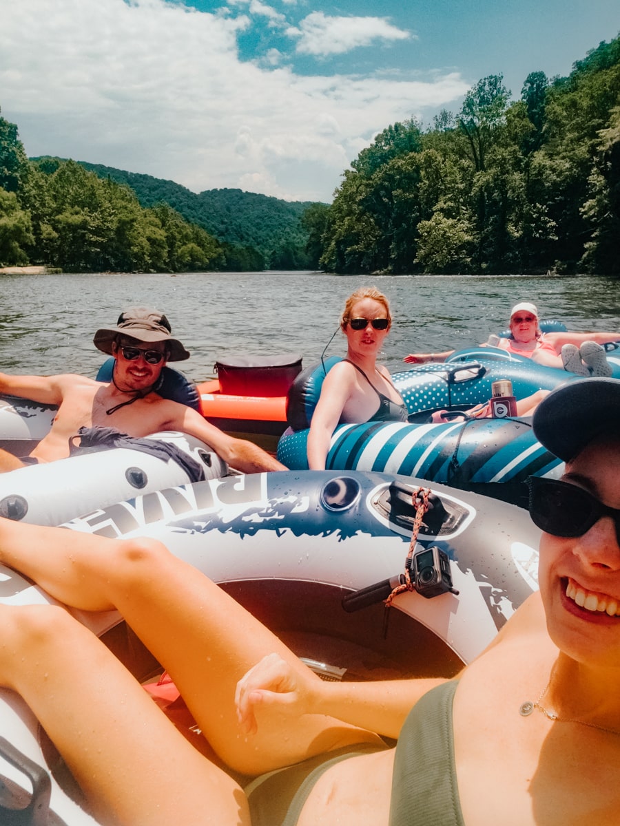 Family floating and tubing down the Nolichucky River in East TN near Johnson City
