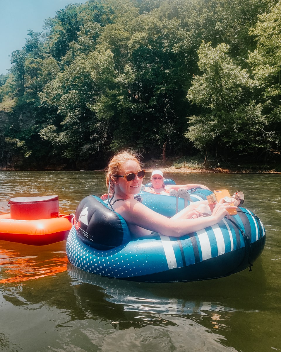 Woman floating the Nolichucky River in an inner tube