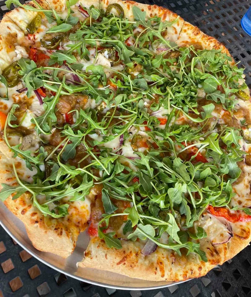 thai pai pizza with arugula and chutney 