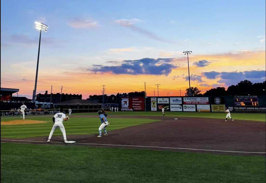 Baseball game in johnson city at sunset