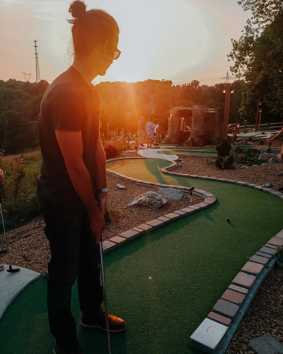 Guy playing mini golf at Paradise Acres in Johnson City TN