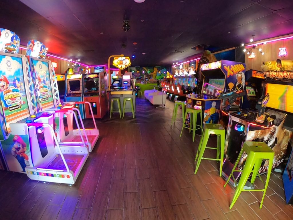 Retro arcade with pinball machines and neon lights