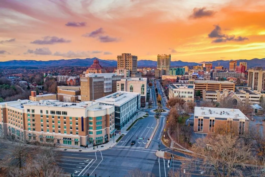 Aerial view of downtown Asheville, NC at sunset.