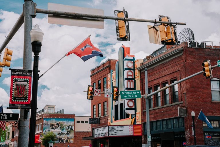 Downtown Bristol, TN-VA with brick buildings, street traffic light, and Tennessee flag.