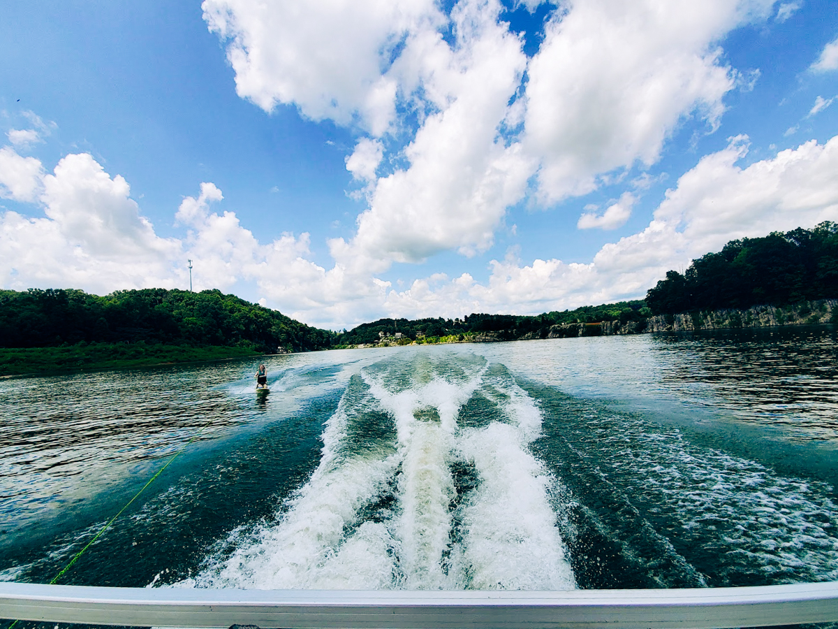 woman knee boarding on boone lake with a boat rental in johnson city tn 