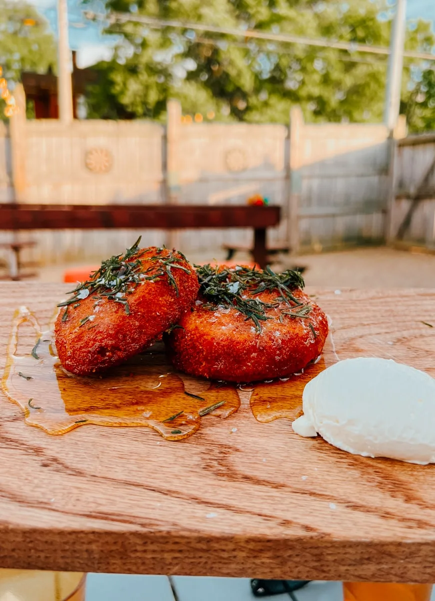 Fried green tomatoes with goat cheese on board at Timber! restaurant in Johnson City.