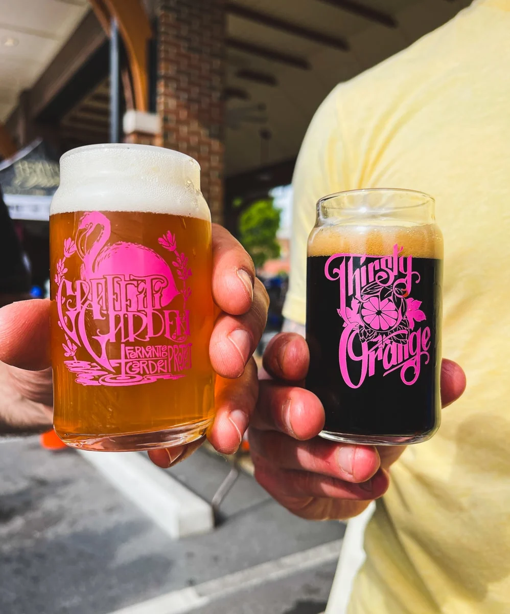 people drinking craft beer from sample glasses at the thirsty orange beer festival in downtown johnson city tn 