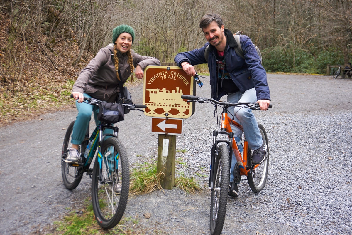 Couple biking on the Virginia Creeper Trail in Virginia