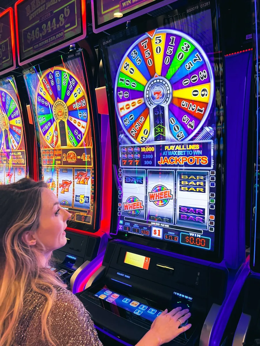 woman playing slot machine