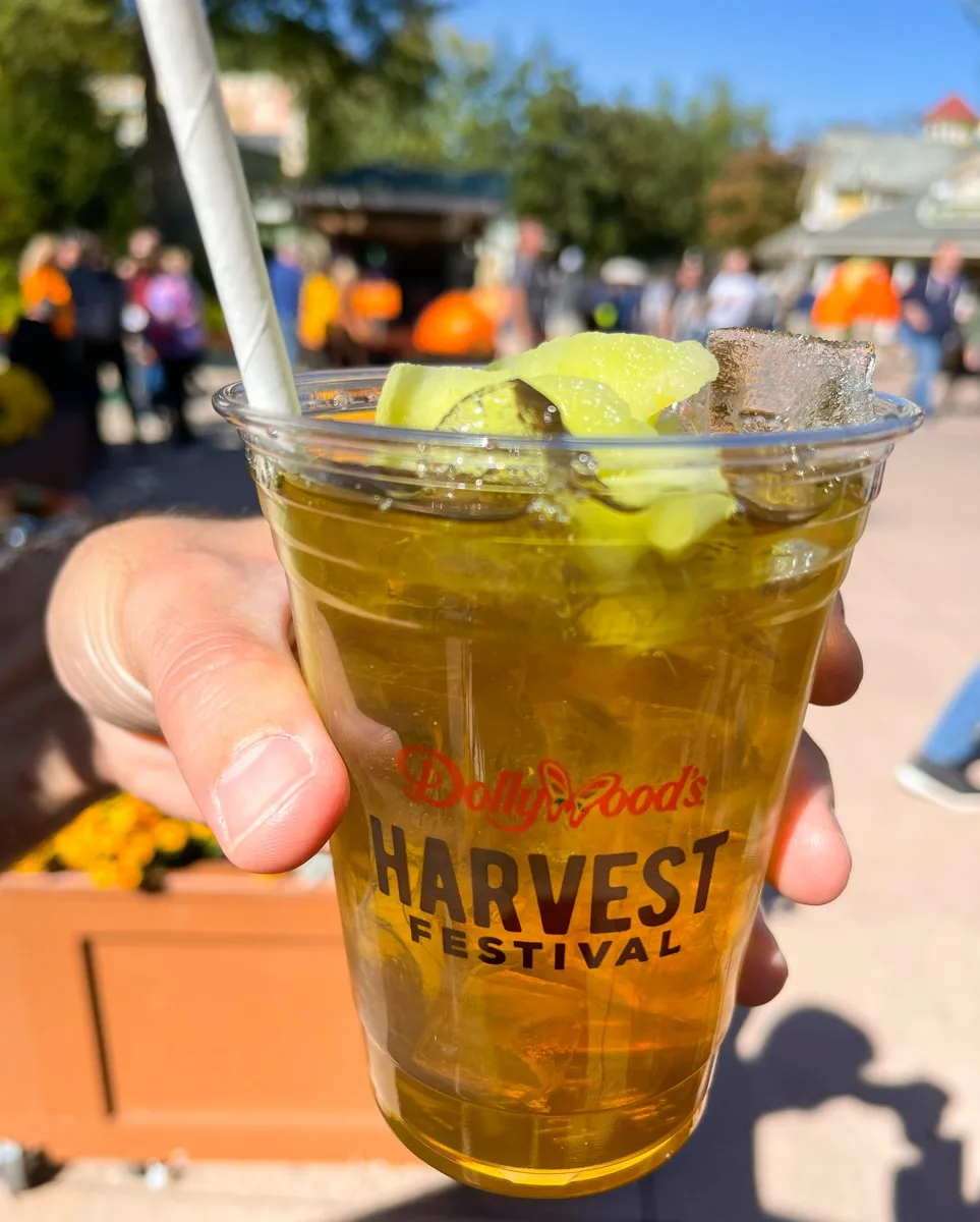 person holding a autumn apple palmer at dollywood's harvest festival