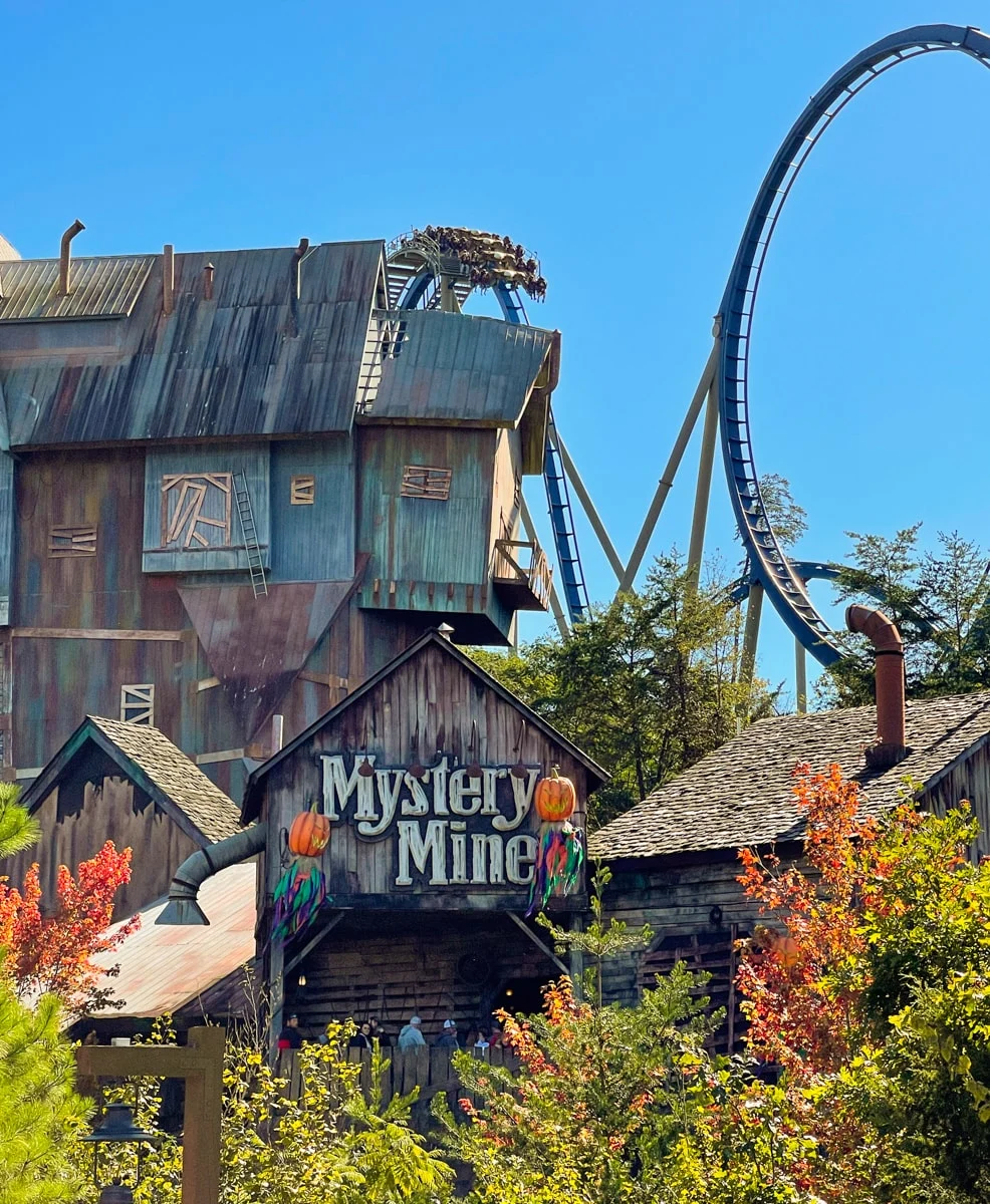 People riding rollercoasters at Dollywood Mystery Mine