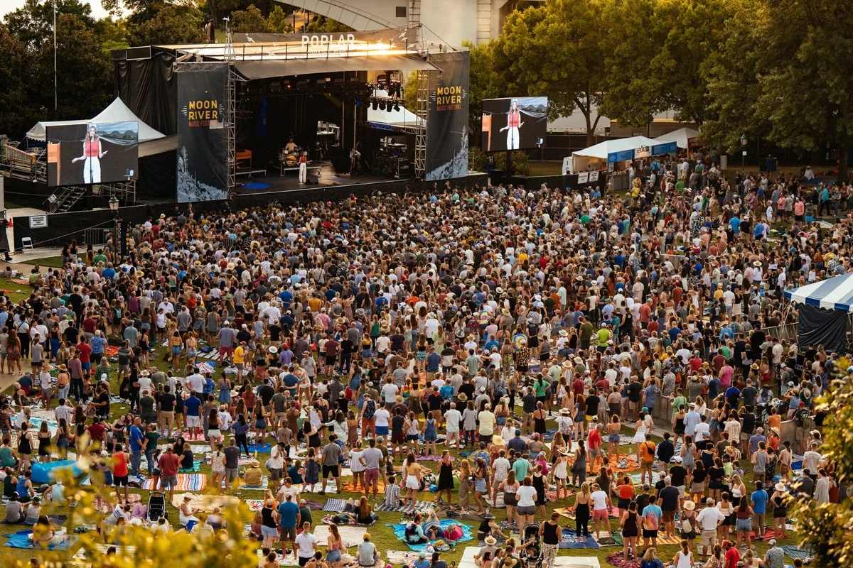 People listening to music looking at the stage for the Moon River Music Festival