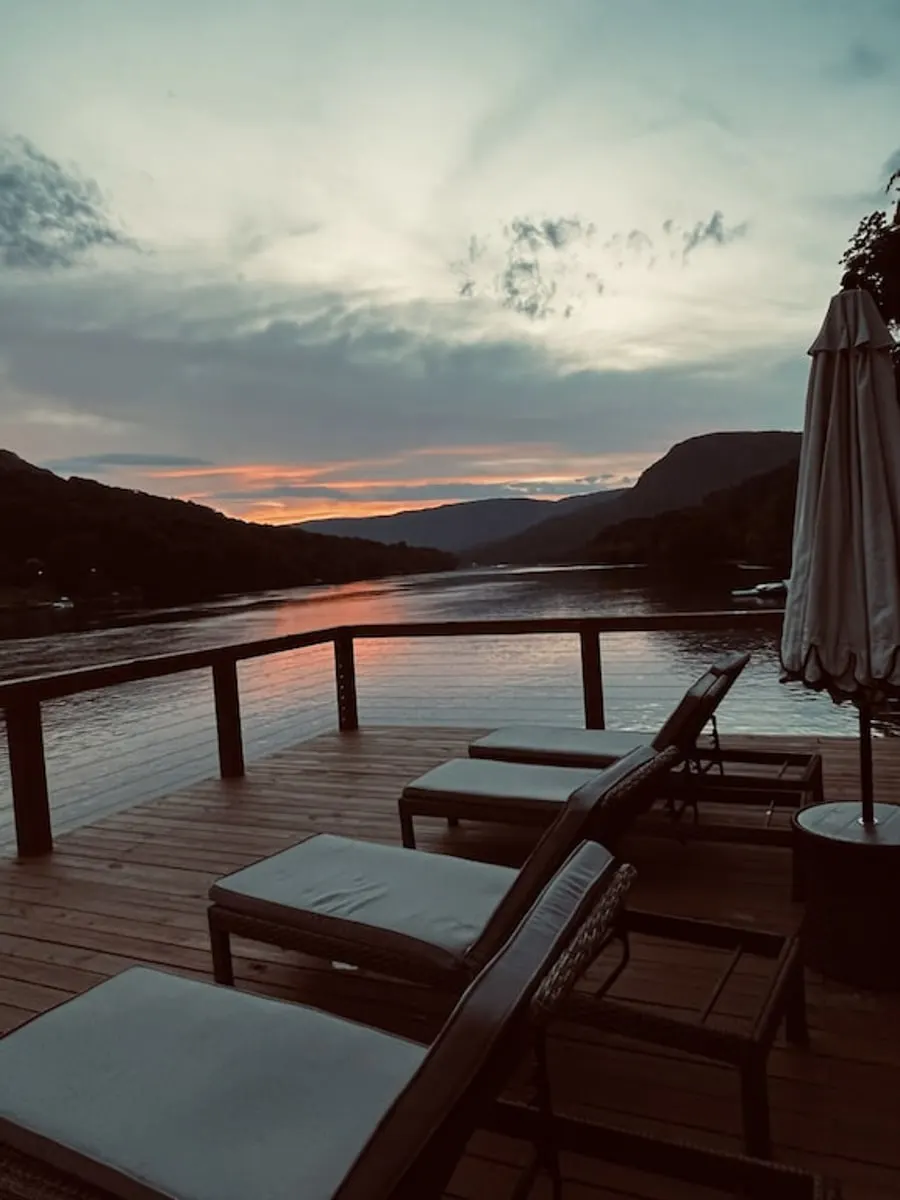 The Tennessee River House dock overlooking the Tennessee River with sun chairs