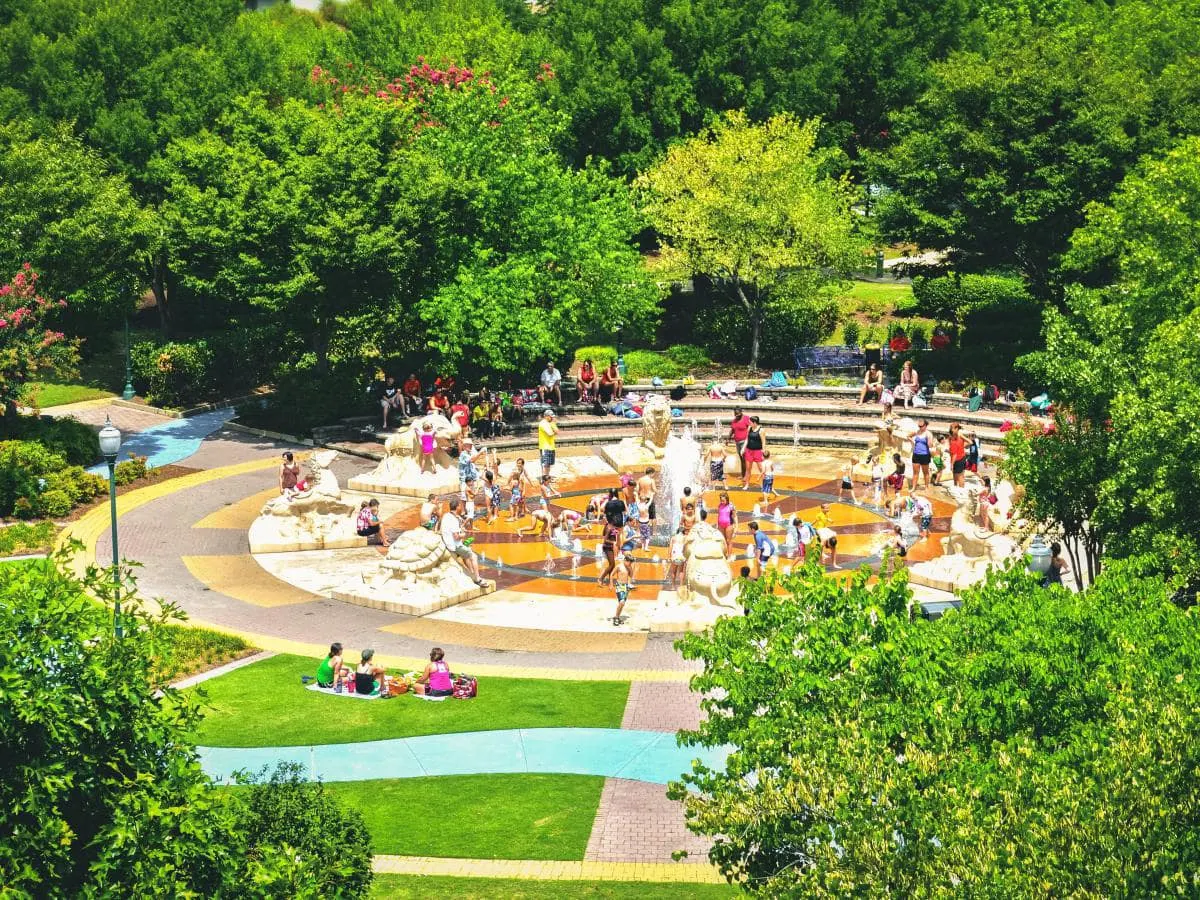 people playing at the splash pad at coolidge park