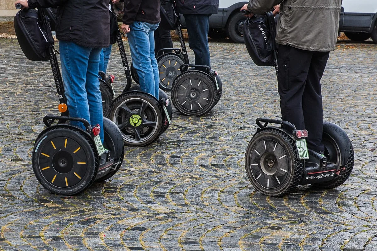 people riding on segways