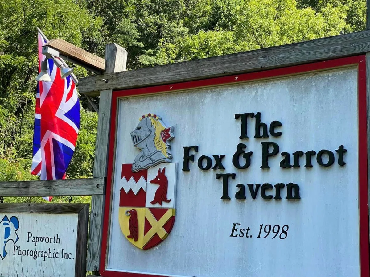 the Fox & Parrot Tavern sign with British flag 