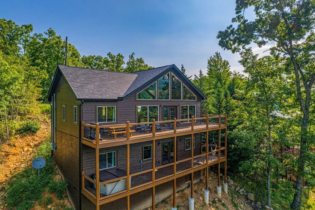 dawn treader cabin in pigeon forge exterior with two large decks and a hot tub overlooking the smoky mountains