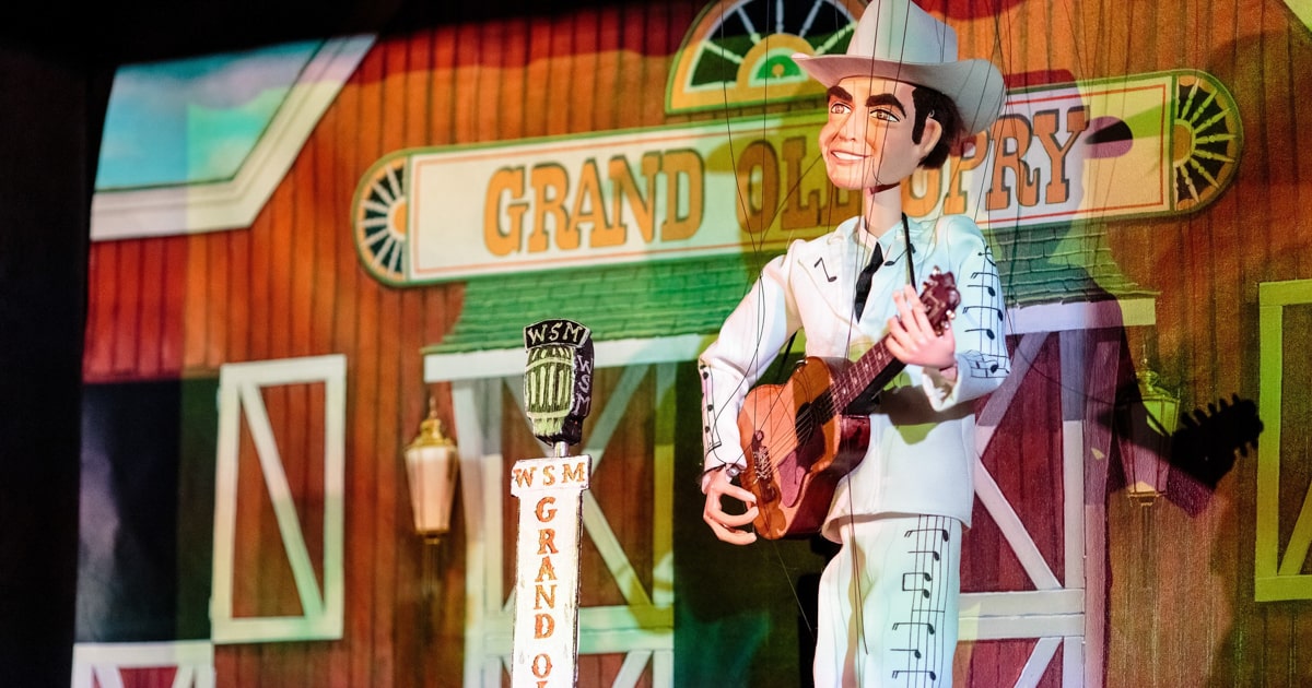 a puppet elvis prop playing on the grand ole opry stage at the Country Music Hall of Fame and Museum 