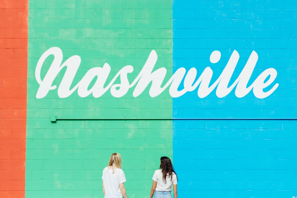 colorful wall with Nashville words in cursive