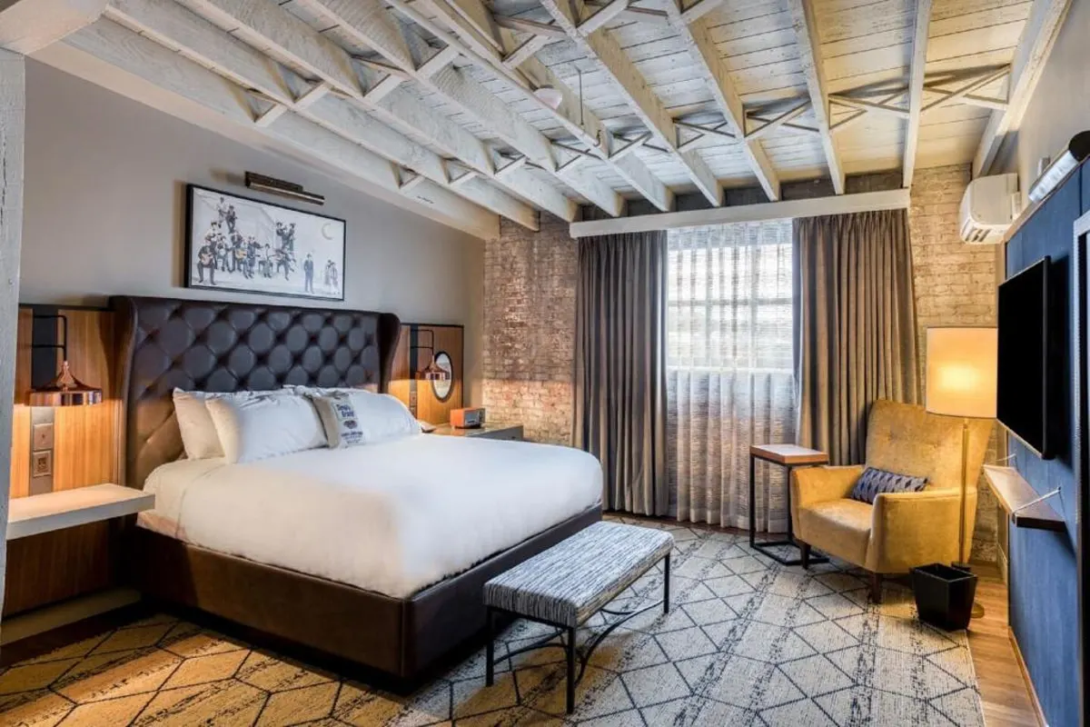 The sessions hotel king size bed with brick wall feature