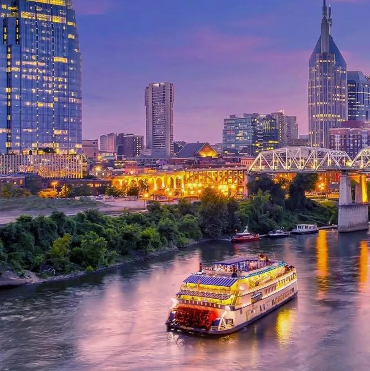 People riding along the river on a dinner cruise in downtown Nashville TN