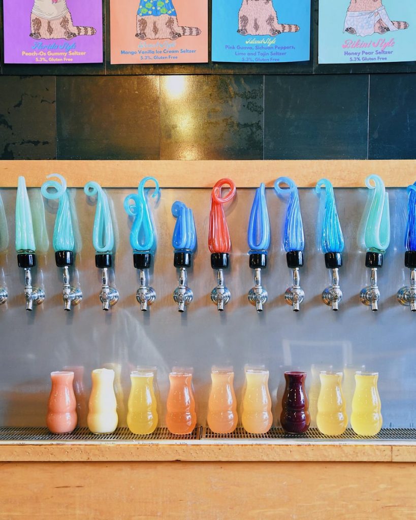 Craft Beers under colorful taps at Pretentious Beer Company
