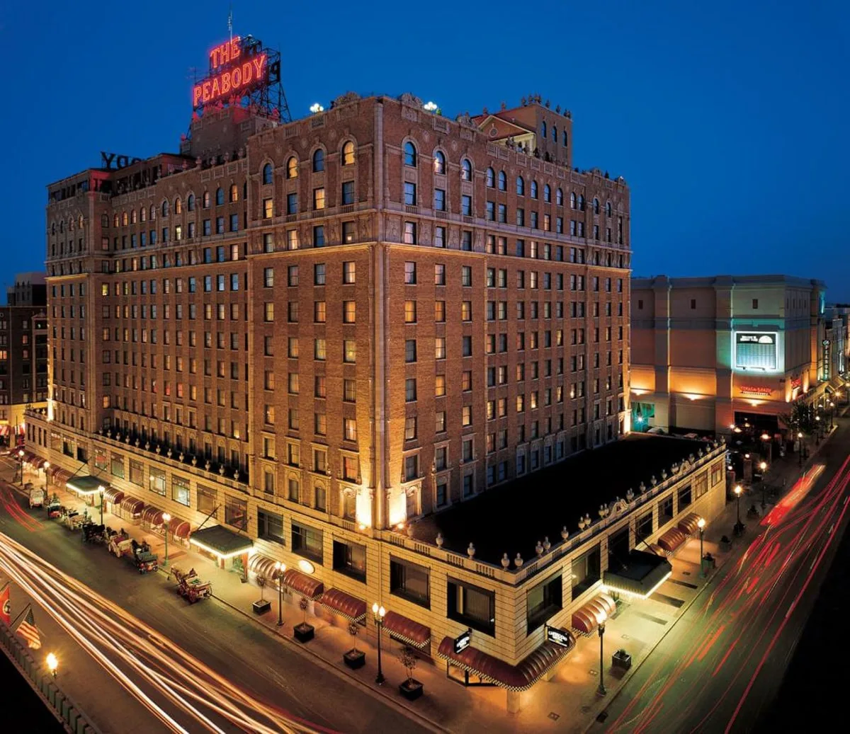 the exterior of the peabody hotel at night in memphis 