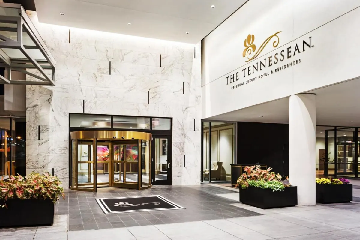 the Tennesseean luxury hotel entrance with white marble siding and the tennesseean sign