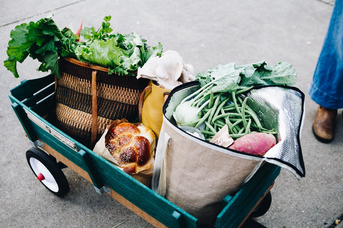 A pull along wagon full of vegetables and bread from the Winter Farmers' Market in downtown Knoxville TN 
