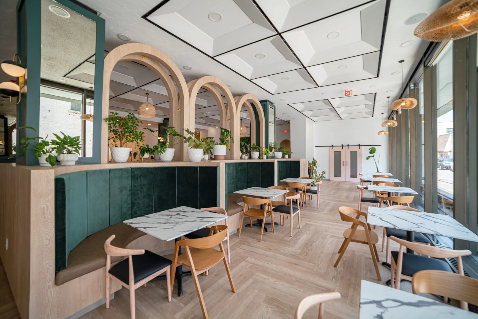 interior of bloom restaurant with plants and bright ambience