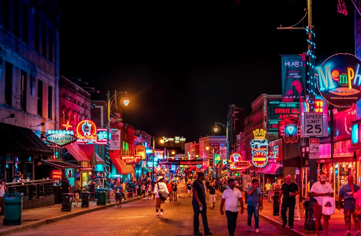 people walking along Beale street in downtown Memphis 