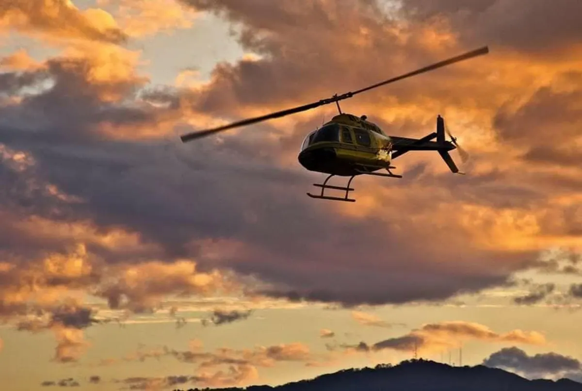 Helicopter flying over the smoky mountains at sunset in Pigeon Forge TN 