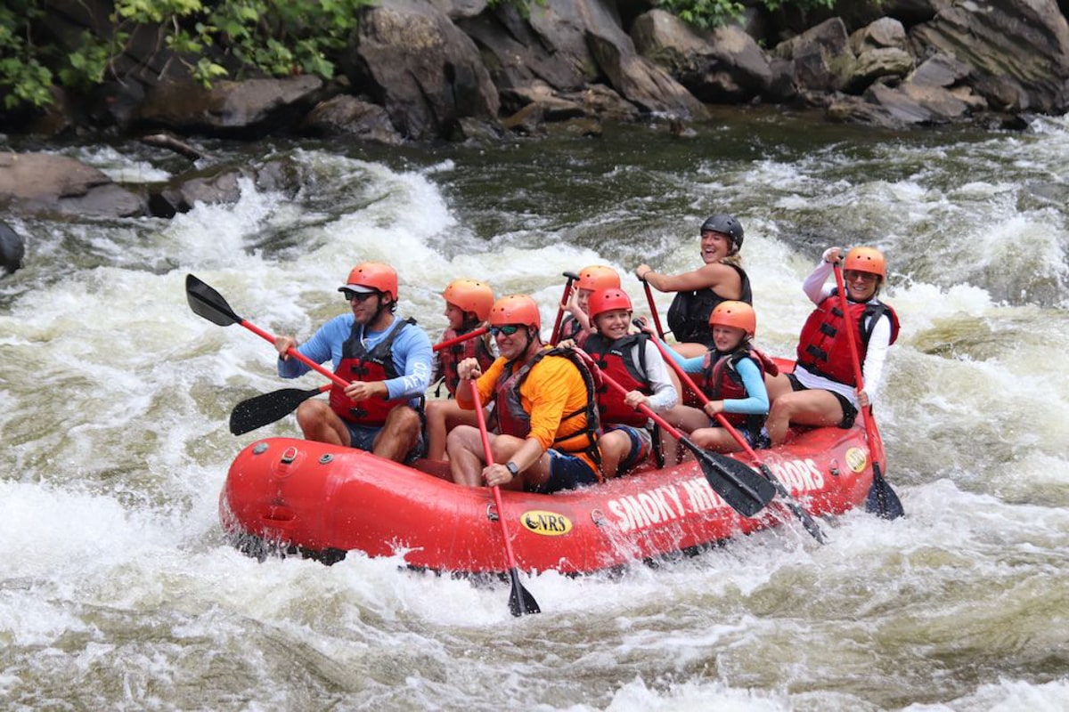 People whitewater rafting down the Pigeon River in Gatlinburg TN 