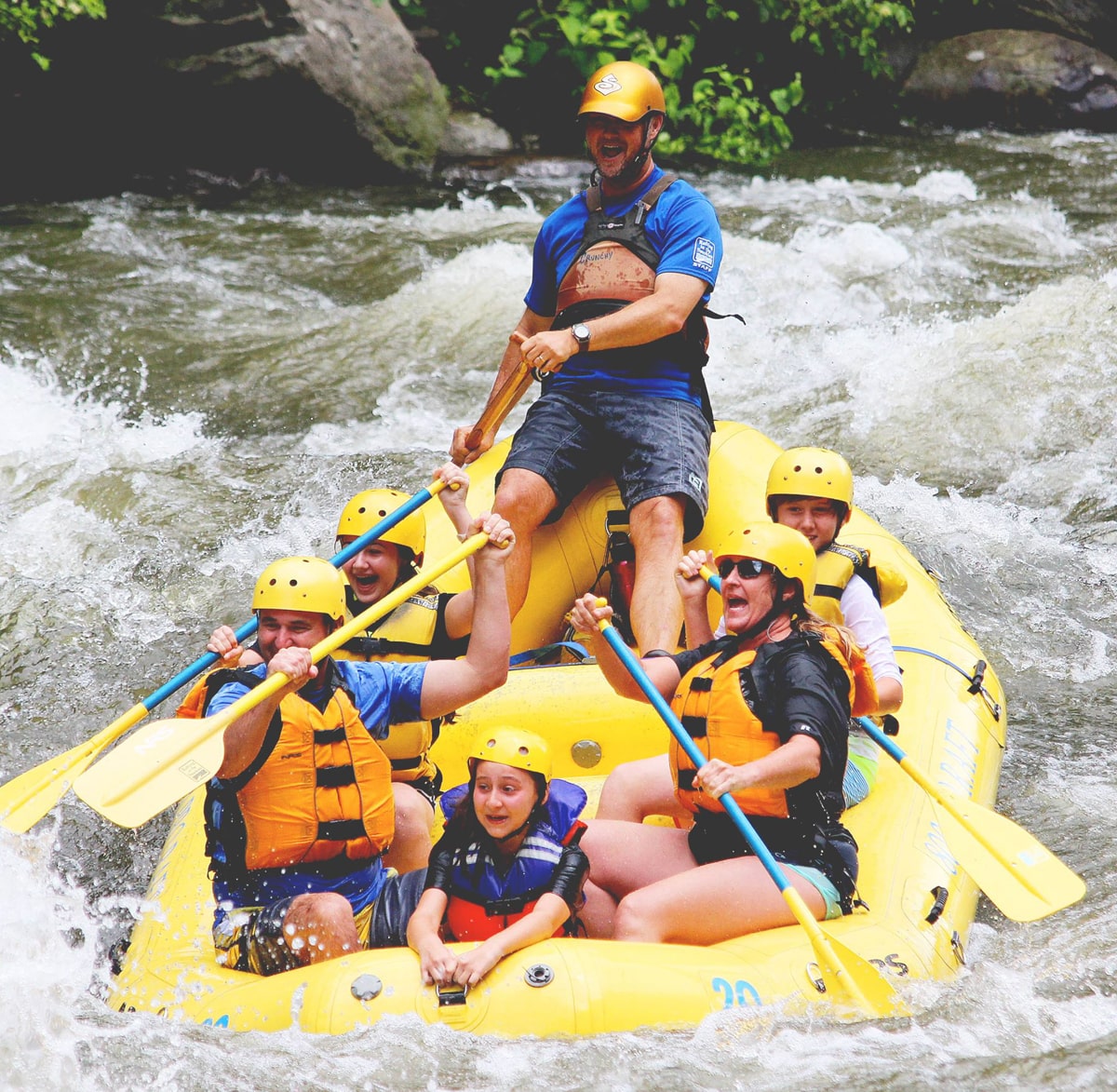 adults and children rafting down the pigeon river with rafting in the smokies tour