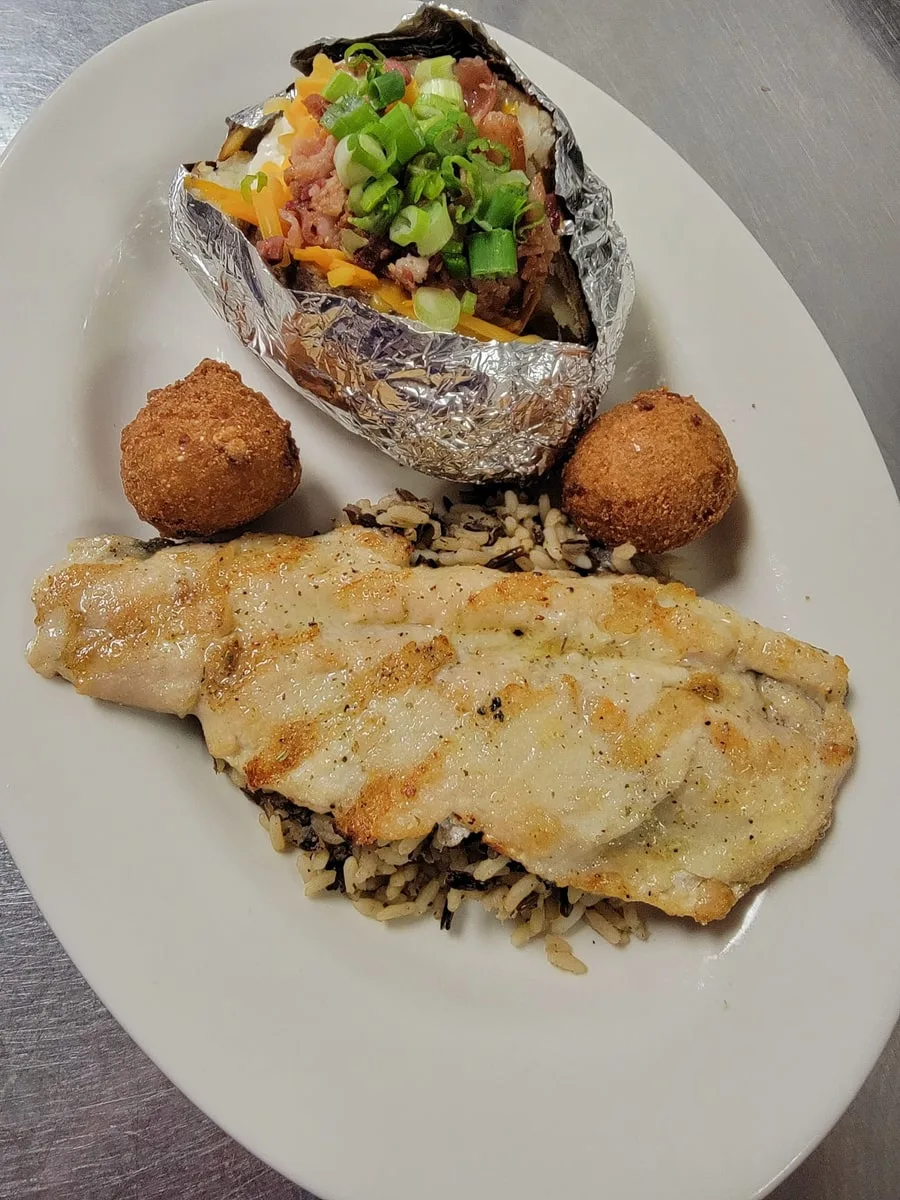 fish, hushpuppies, and baked potato from the riverfront seafood restaurant in kingsport tn 