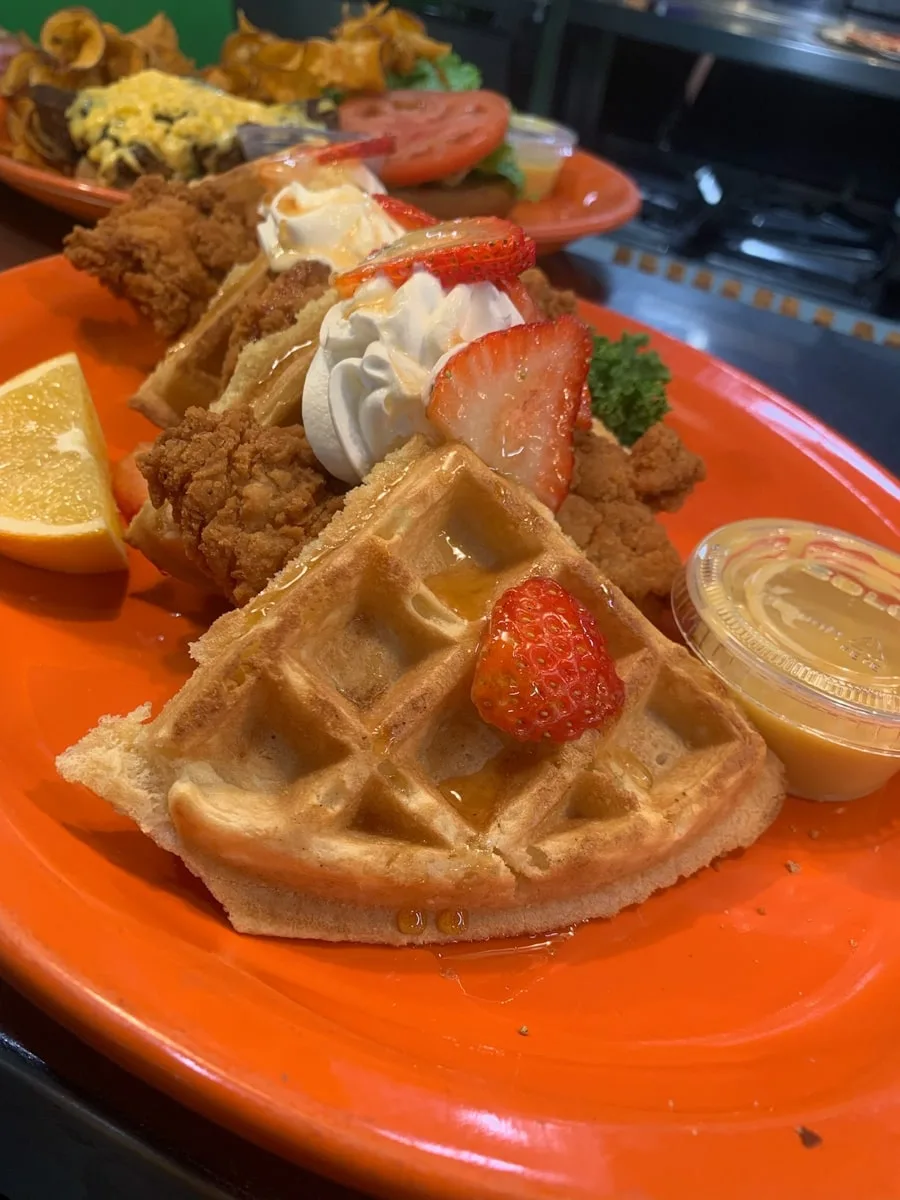 Cootie Browns Chicken and Waffles topped with strawberries in Johnson City TN