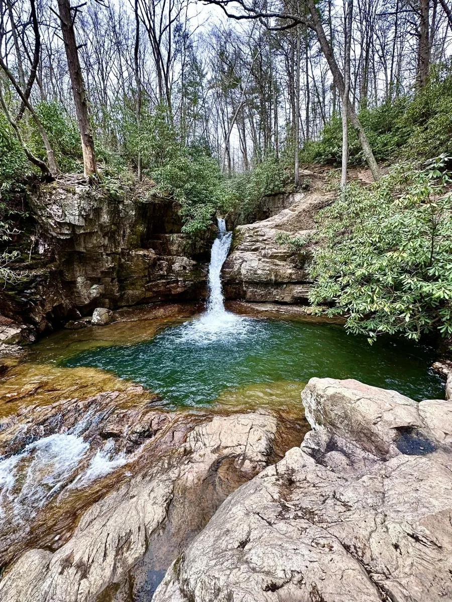 Blue Hole Falls in Elizabethton TN plunging into a blue swimming hole below