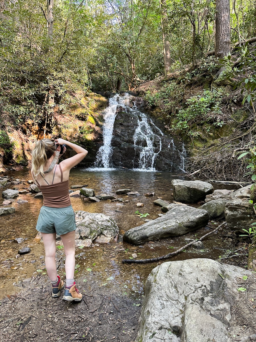woman photographing Martin's Creek Falls in Erwin TN 