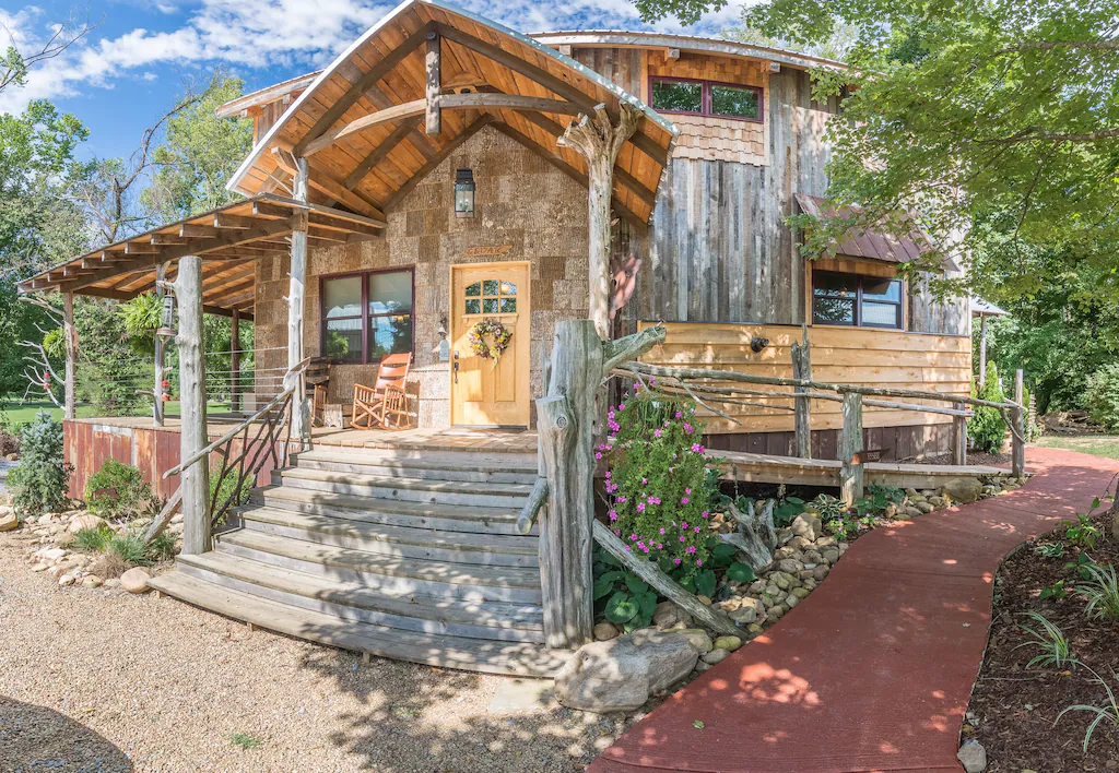 a cozy cabin with flowers and wood siding on the watauga river in tn 