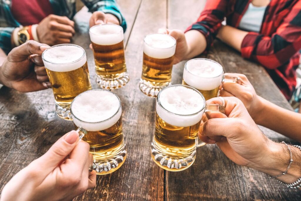 Friends gather around with craft beer in Nashville, TN.