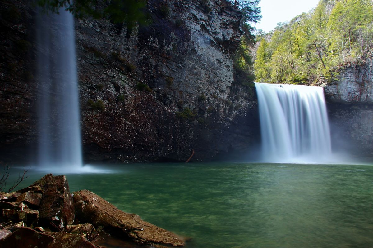 Cane Creek Falls waterfall tumbling into pool.