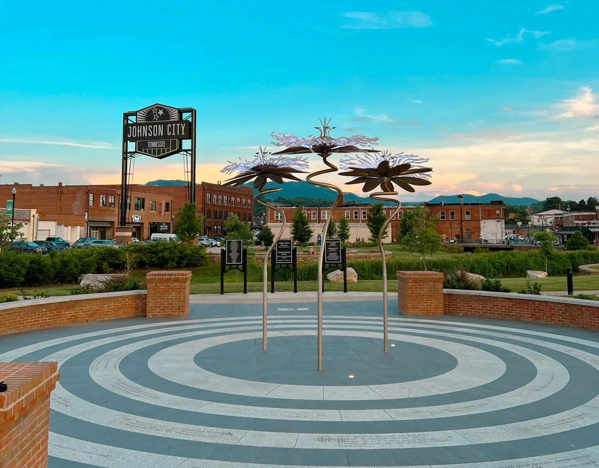 johnson city king commons park at sunset with flower scultpures