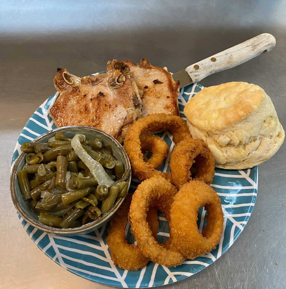 fried pork chops with southern style green beans and onion rings at southern restaurant in elizabethton tn 