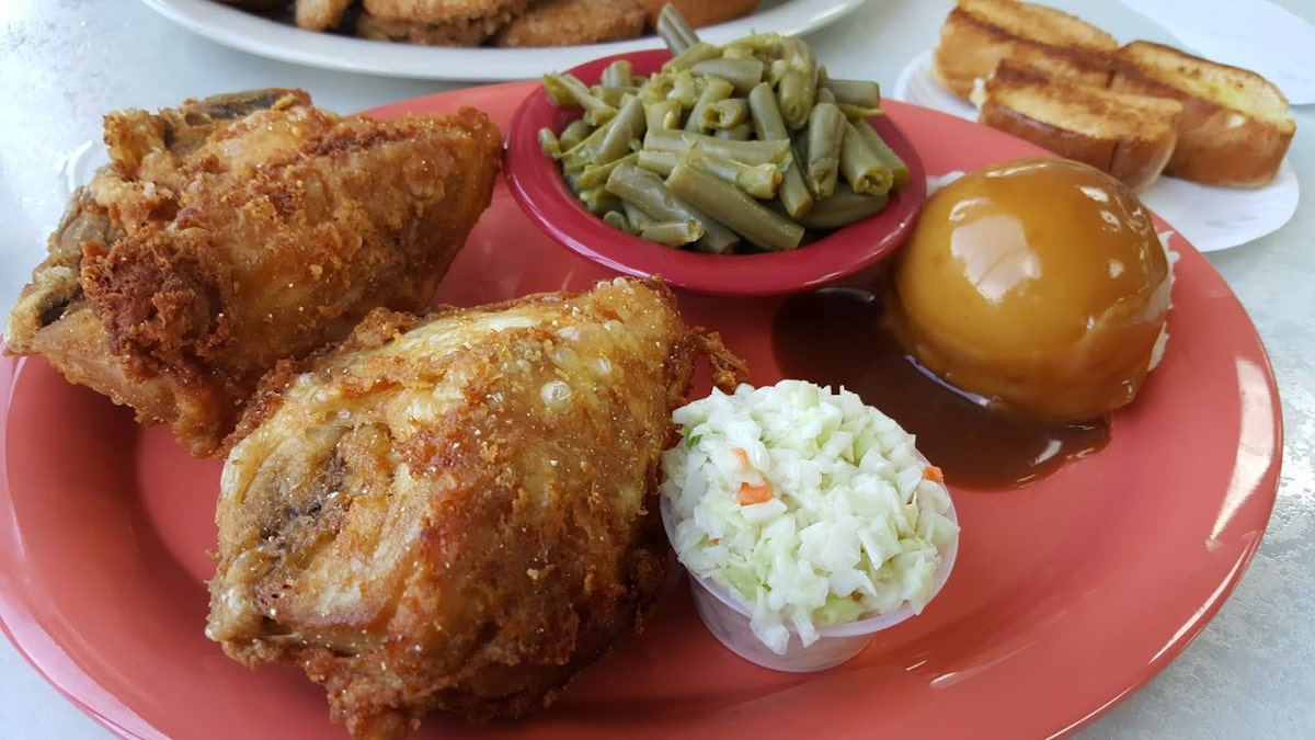 fried chicken with mashed potatoes and gravy, green beans, and slaw at clarences drive-in in erwin tn