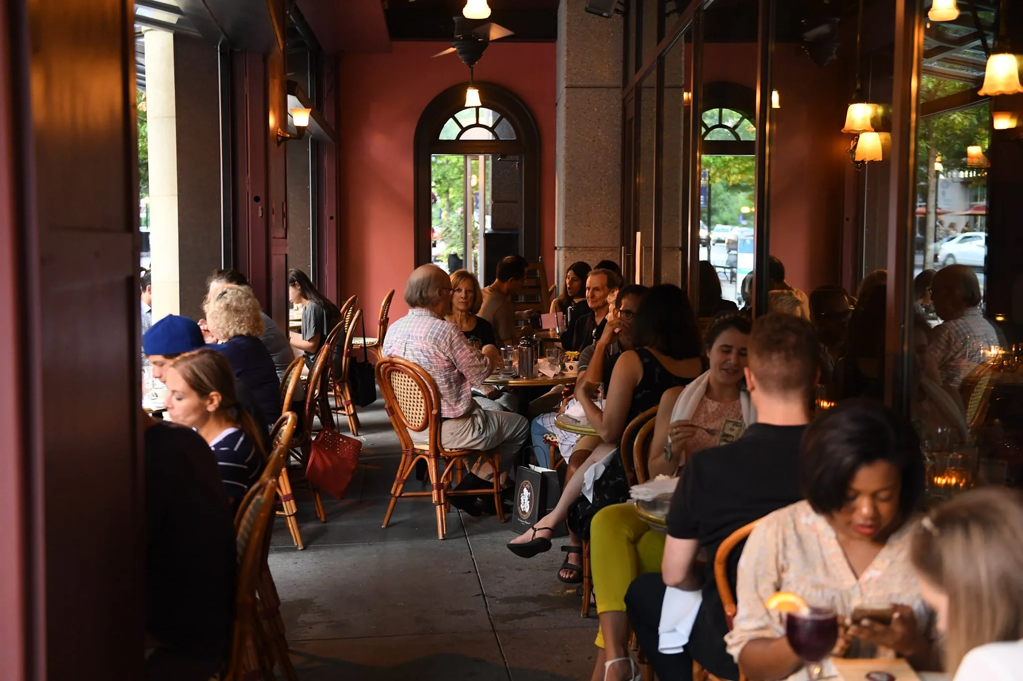 people sitting outside at the cafe enjoying coffee at cafe intermezzo in nashville tn 