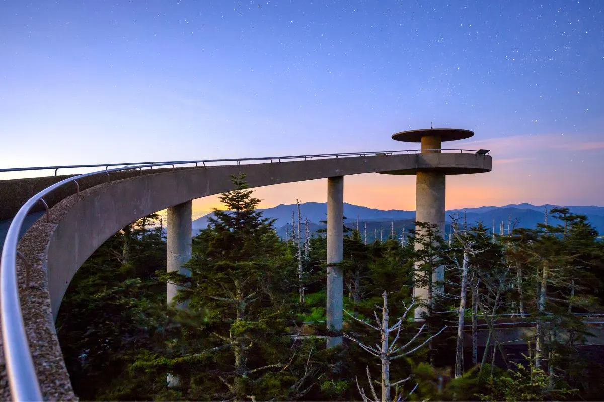 clingmans dome at sunset with trees and blue sky 