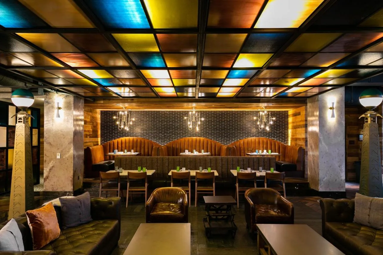 restaurant at the bobby hotel in nashville with comfortable seating and colorful tile ceiling 