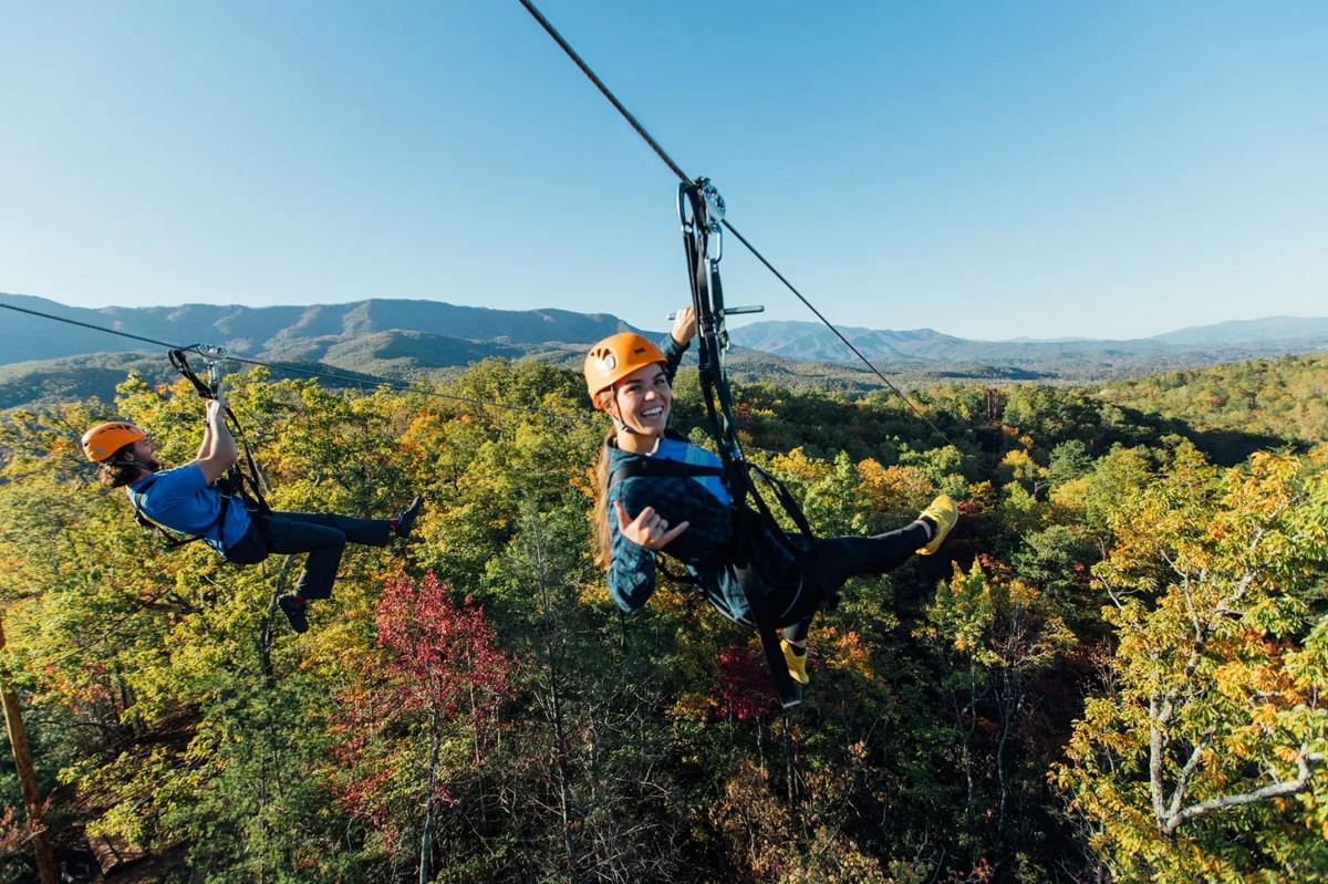 girl ziplining through the treest at climbworks in Gatlinburg TN 